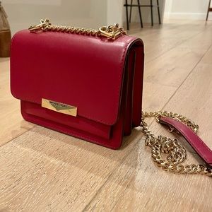 Red Michael Kors gold chain crossbody purse